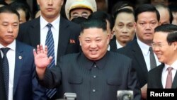 North Korea's leader Kim Jong Un waves as he arrives at the Dong Dang railway station, Vietnam, at the border with China, Feb. 26, 2019. 