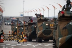FILE - Amphibious assault vehicles of the South Korean Marine Corps travel during a military exercise as a part of the annual joint military training called Foal Eagle between South Korea and the U.S. in Pohang, South Korea, April 5, 2018.