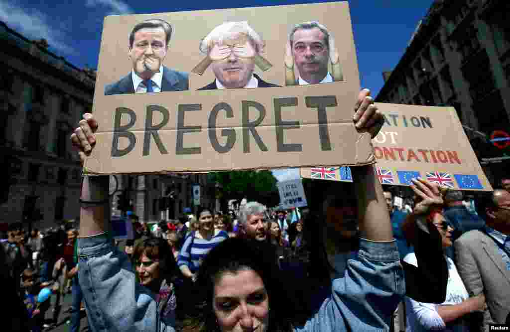 People hold banners during a 'March for Europe' demonstration against Britain's decision to leave the European Union, in central London, Britain, July 2, 2016.