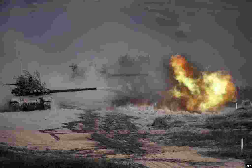 A Russian army T-72-B3 tank fires during military exercises at the Raevsky range in Southern Russia, Sept. 23, 2020, during the "Caucasus-2020" military drills.