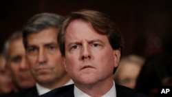 FILE - President Trump's White House counsel, Don McGahn, right, is seen on Capitol Hill in Washington, Feb. 6, 2017.