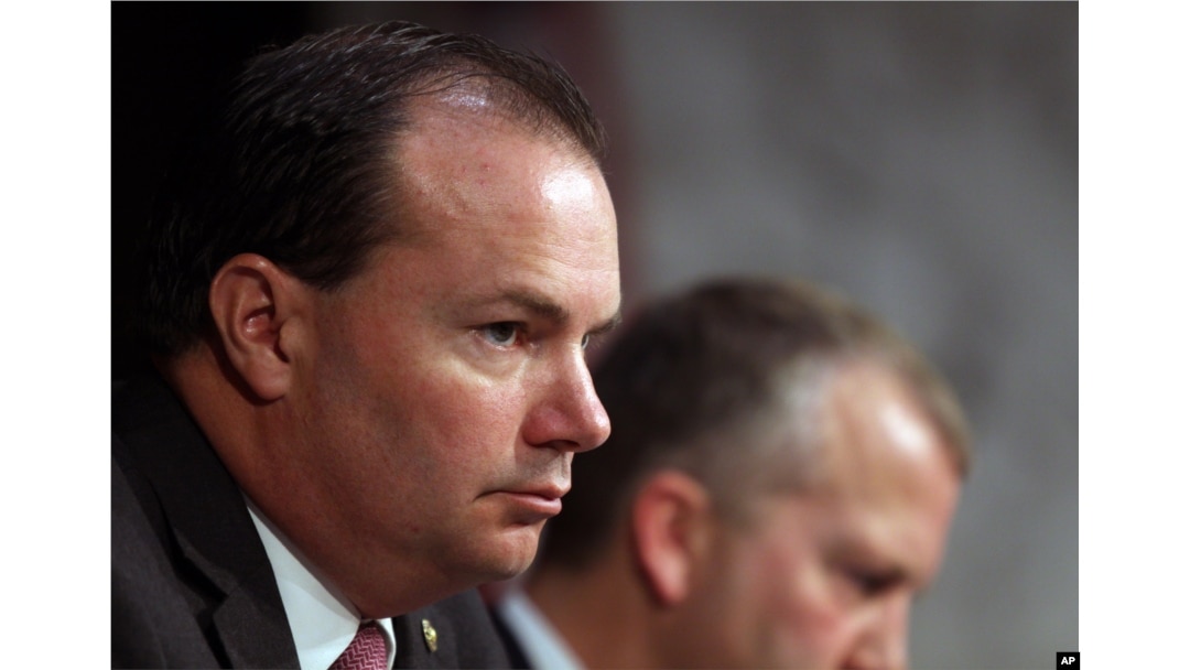 Sen. Mike Lee, R-Utah, listens during a Senate Armed Services Committee on Capitol Hill in Washington, July 21, 2015.