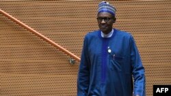 FILE - Nigeria's President Muhammadu Buhari walks after speaking at the 30th annual African Union summit in Addis Ababa, Ethiopia, Jan. 28, 2018.