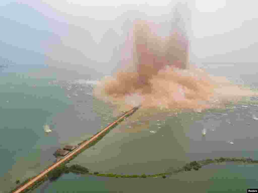 A dike between two lakes is seen under demolition in Wuhan, Hubei Province, China.