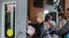 Alexey Navalny's wife, Yulia, enters the Omsk Ambulance Hospital No. 1, intensive care unit where Alexei Navalny was hospitalized in Omsk, Russia, Aug. 21, 2020. 