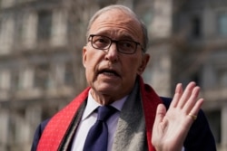 FILE - White House chief economic adviser Larry Kudlow talks to reporters about the economic impact of the coronavirus, at the White House, March 16, 2020, in Washington.