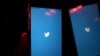 A mobile phone user turns on Twitter application on his smartphone in Moscow, Russia, March 10, 2021.