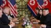 North Korea's leader Kim Jong Un and U.S. President Donald Trump look on during the extended bilateral meeting in the Metropole hotel during the second North Korea-U.S. summit in Hanoi, Vietnam, Feb. 28, 2019. 