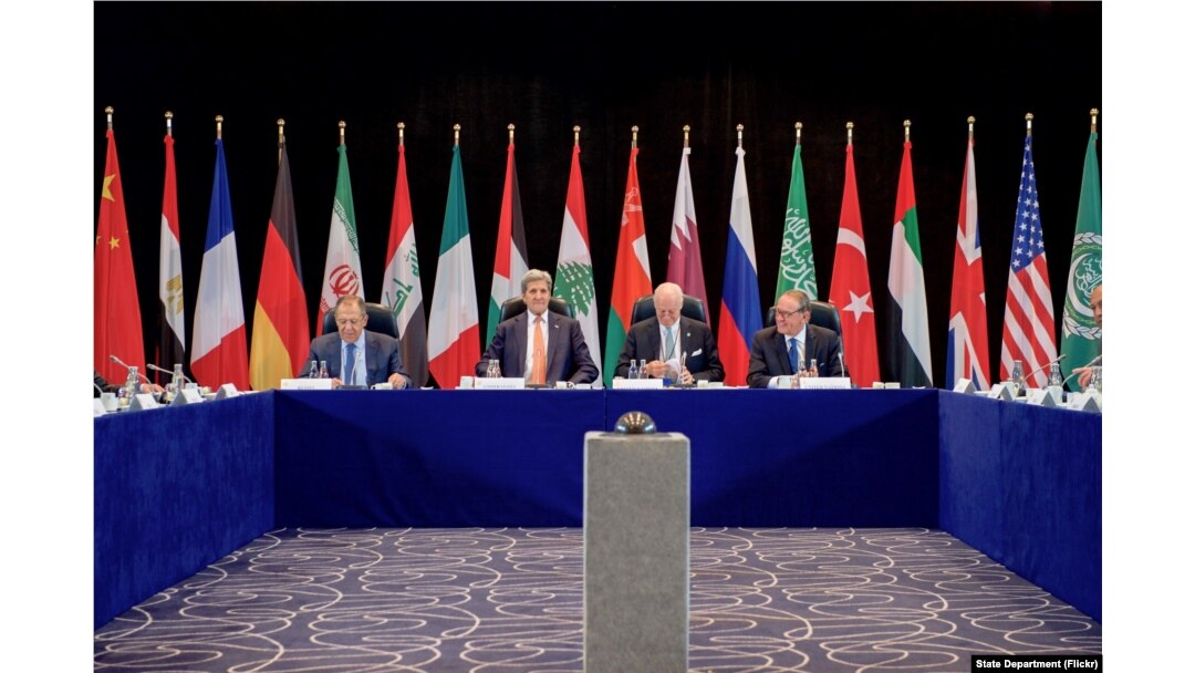 U.S. Secretary of State John Kerry sits with Russian Foreign Minister Sergey Lavrov, United Nations Special Envoy for Syria Staffan de Mistura, and UN Deputy Secretary-General Jan Eliasson on Feb. 11, 2016, at the Hilton Hotel join Munich, Germany.