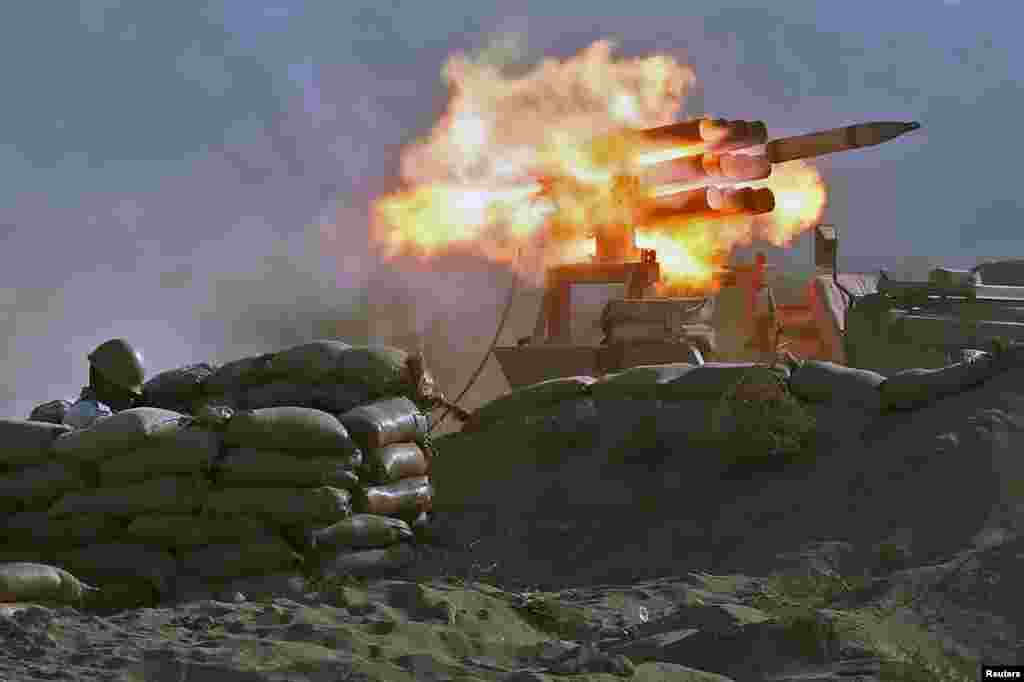 Members of the Iranian Army fire missiles during the annual military drill, dubbed “Zolphaghar 99”, in the Gulf of Oman.