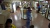 FILE - A man carries boxes at the Page shopping center in Ciudad del Este, Paraguay, Nov. 30, 2001. Police raided an electronics store in this shopping center, seizing documents and other material that officials said promoted Hezbollah, Lebanon's Islamic militant party.