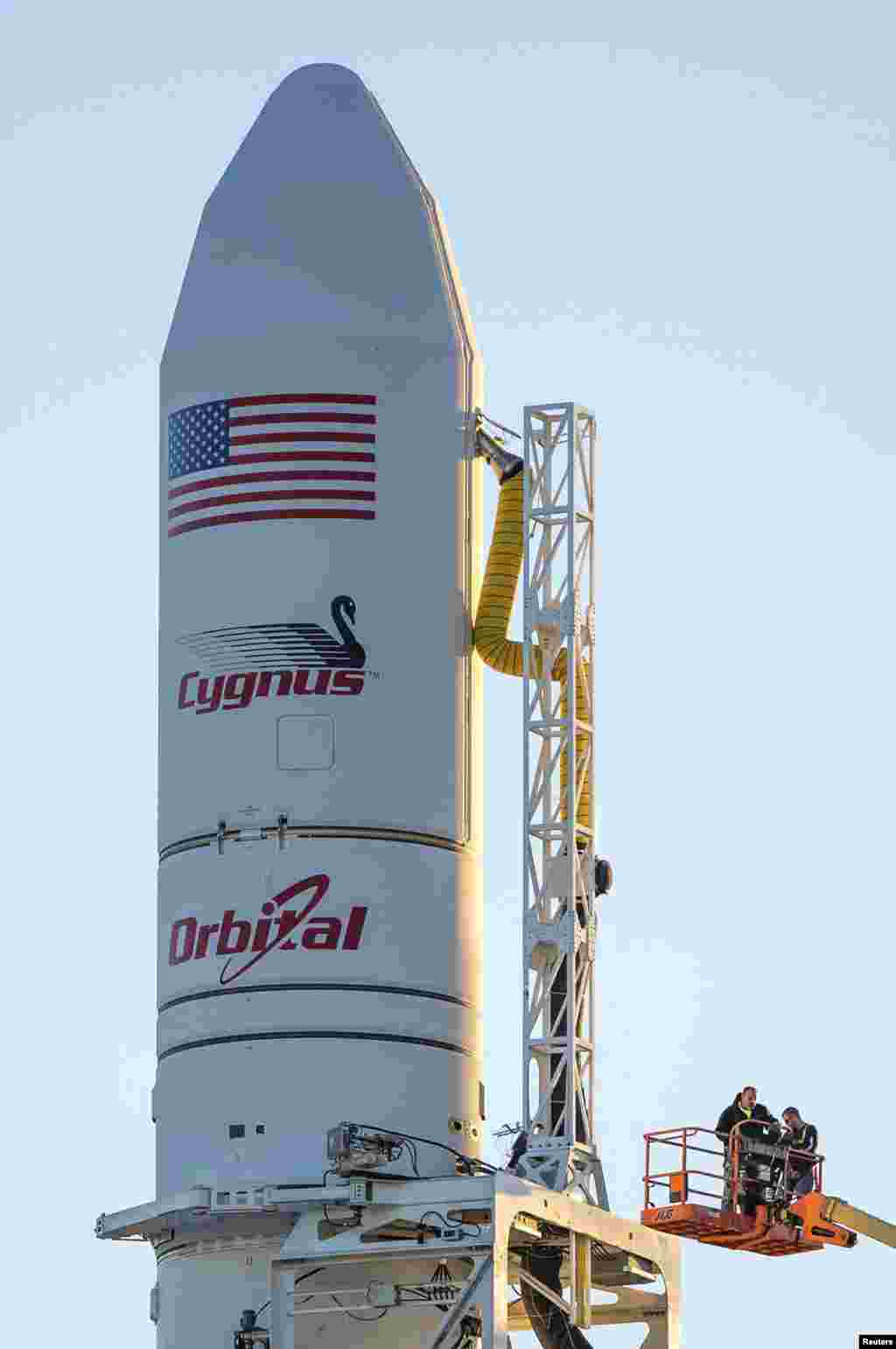 Orbital Sciences Corporation's Antares rocket and Cygnus cargo spacecraft are prepared for launch at the Mid-Atlantic Regional Spaceport on Wallops Island, Virginia in this NASA handout picture released Oct. 27, 2014.