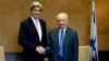 US Sen. John Kerry, D-Mass, left, shakes hands with Israel's President Shimon Peres, during their meeting in the coastal city of Caesarea, Israel, Tuesday, March 22, 2011.
