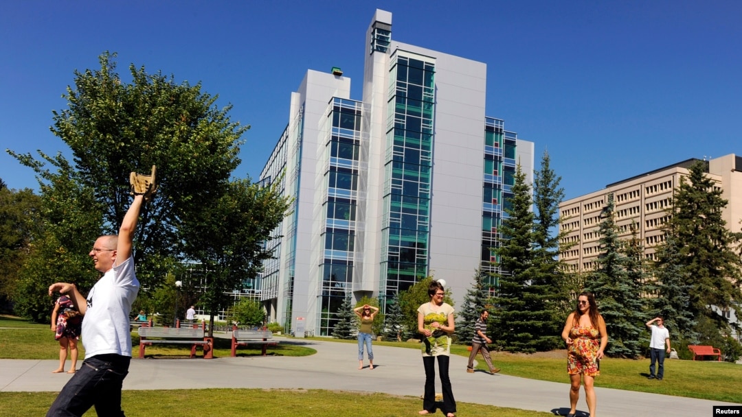 FILE - Students play a game of pickup baseball on campus at the University of Calgary in Calgary, Alberta, August 26, 2010. 