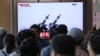 People watch a TV broadcast showing file footage of North Korean missiles, during a news program at the Seoul Railway Station, in Seoul, South Korea, May 9, 2019. North Korea reportedly launched two projectiles off its east coast early Thursday.