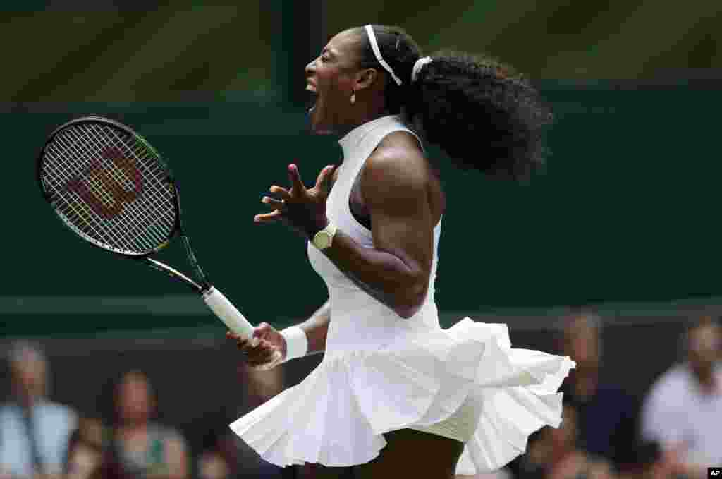 Serena Williams of the U.S celebrates a point against Amara Safikovic of Switzerland during their women's singles match on day two of the Wimbledon Tennis Championships in London.