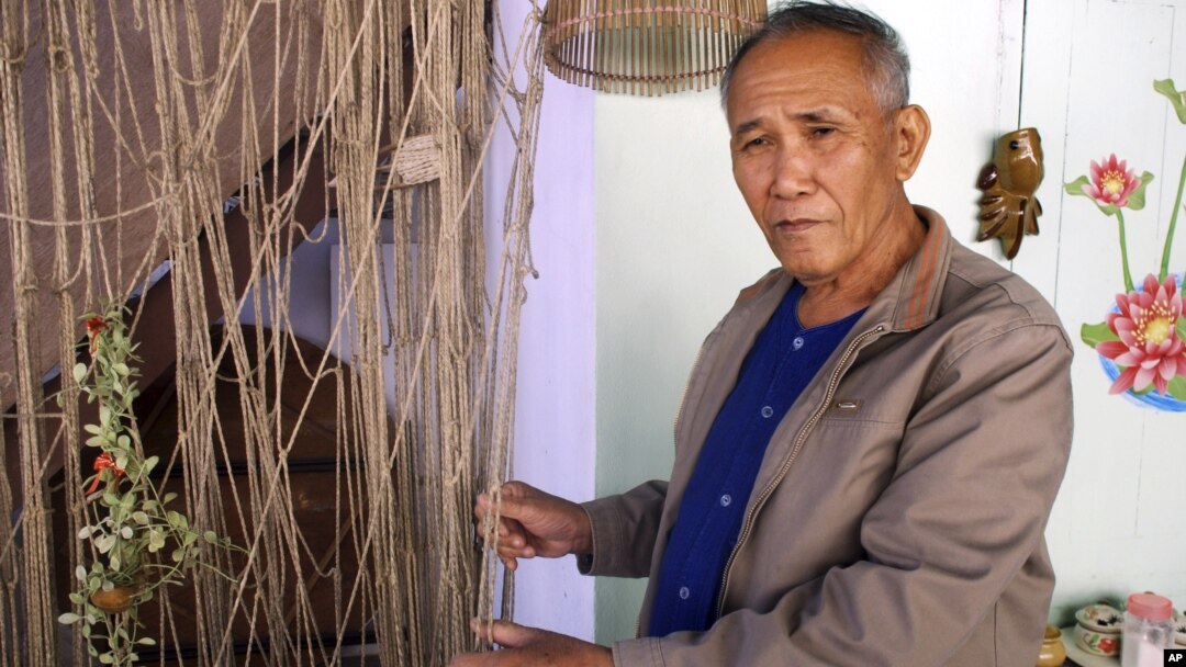 Boonrian Chinnarat holds a net he once used to catch giant catfish at his house in Chiang Kong district of Chiang Rai province, northern Thailand, Feb. 7, 2011. He blames the disappearance of the fish partly on China's upstream dams.