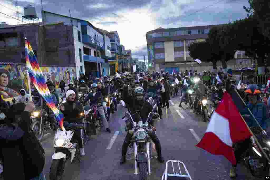 Anti-government demonstrators participate in a motorcycle caravan in Juliaca, Peru, Jan. 30, 2023. The protesters are seeking immediate elections, President Dina Boluarte's resignation, closure of the Congress and the release of former president Pedro Castillo, who was ousted and arrested for trying to dissolve Congress in December.