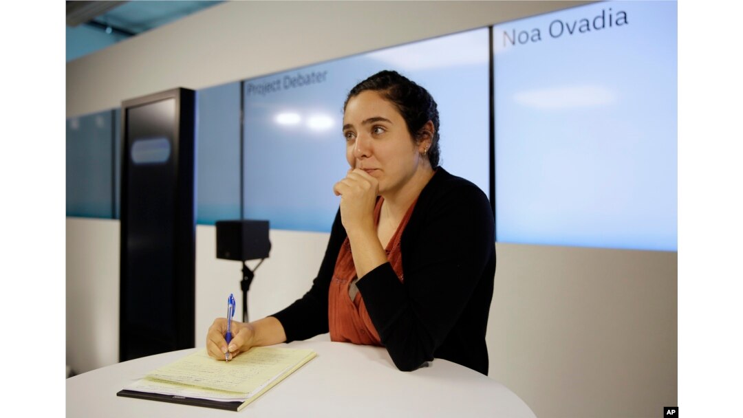 Noa Ovadia takes notes during her debate against the IBM Project Debater in San Francisco, June 18, 2018.