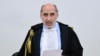 Court President Alfredo Montalto delivers the verdict in the case of an alleged people-smuggling kingpin identified as Medhanie Yehdego Mered, who said he was not the man authorities sought, in Palermo, Italy, July 12, 2019.