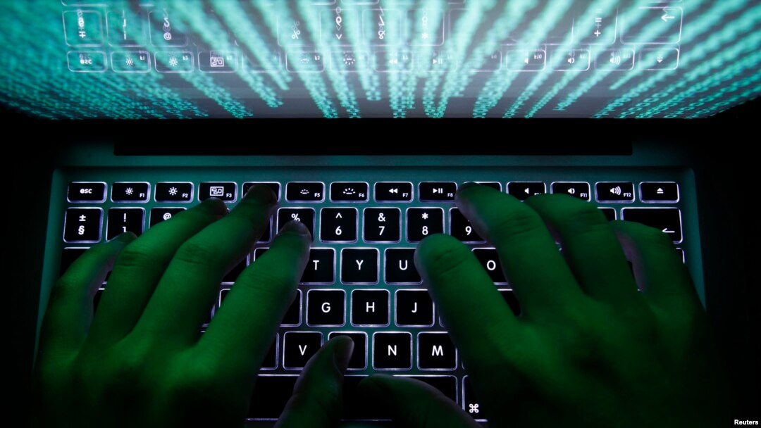 FILE - A man types on a computer keyboard in a Feb. 28, 2013, illustration picture.