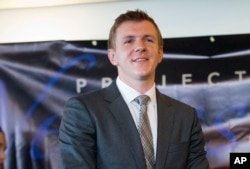 FILE - James O'Keefe, President of Project Veritas Action, waits to be introduced during a news conference at the National Press Club in Washington, Sept. 1, 2015.