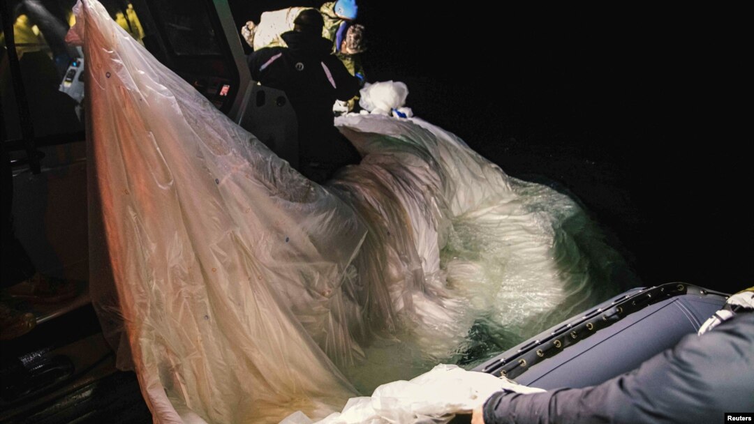 Sailors assigned to Explosive Ordnance Disposal Group 2 recover a suspected Chinese high-altitude surveillance balloon that was downed by the United States over the weekend off the coast of Myrtle Beach, South Carolina, Feb. 5, 2023.