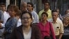 People line up outside a polling station during congressional elections in Caracas, Venezuela, Sunday, Sept. 26, 2010.