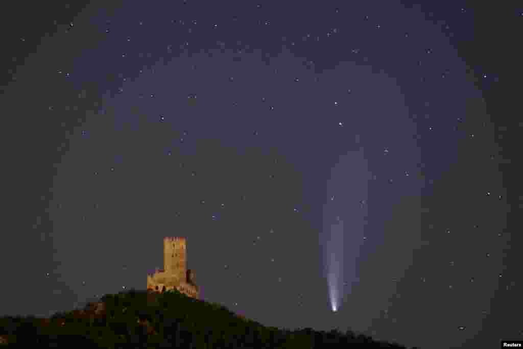 The Comet C/2020 or "Neowise" is seen in the sky over Ortenbourg castle, near Scherwiller, France.