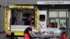 An empty stretcher is moved back into an ambulance which is believed to have transported Alexei Navalny to the Charité Clinic for treatment, in Berlin, Germany, Aug. 22, 2020.
