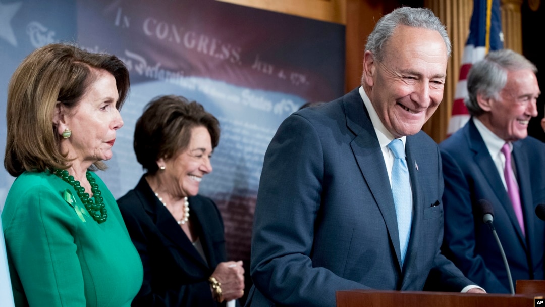 Senate Minority Leader Chuck Schumer of New York, accompanied by Sen. Ed Markey, D-Mass., right, Rep. Anna Eshoo, D-Calif., second from left, and House Minority Leader Nancy Pelosi of California, left, speak to reporters on Capitol Hill in Washington, May 16, 2018, after the Senate passed a resolution to reverse the FCC decision to end net neutrality.