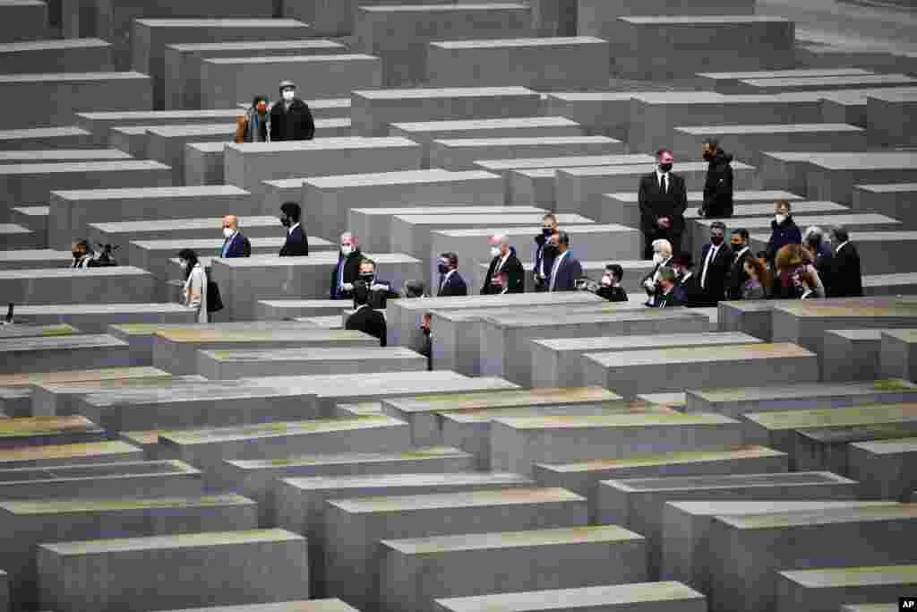 German Foreign Minister Heiko Maas, gestures at center, as he visits the Holocaust Memorial in Berlin with his counterparts from Israel Gabi Ashkenazi, below fourth right from center, and the United Arab Emirates Sheikh Abdullah bin Zayed Al Nahyan, second right from center.