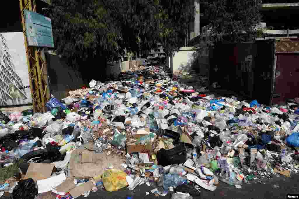 Piled up garbage is seen on a street in Ain el-Remmaneh, Lebanon, Sept. 21, 2020.