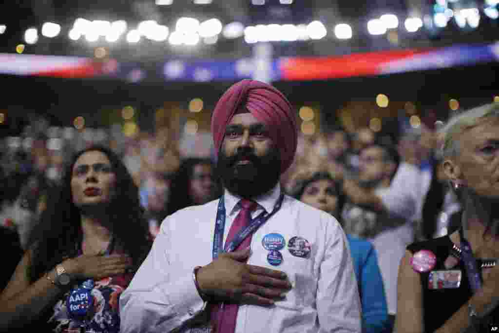 California delegate Gurjatinder Randhawa puts hand over his chest during the national anthem during the first day of the Democratic National Convention in Philadelphia, July 25, 2016.