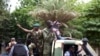 Malian soldiers drive through the streets of Bamako, Mali, Aug. 19, 2020, the day after rebel troops seized Malian President Ibrahim Boubacar Keita and Prime Minister Boubou Cisse in a dramatic escalation of a months-long crisis. 