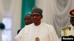 Nigeria's President Muhammadu Buhari attends the opening of the 56th Ordinary Session of the ECOWAS Authority of Heads of State and Government in Abuja, Nigeria, Dec. 21, 2019.