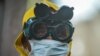 A cleaner wears protective gear to disinfect public transit as a preventive measure against the spreading of the COVID-19 coronavirus in Addis Ababa, Ethiopia, on March 20, 2020.