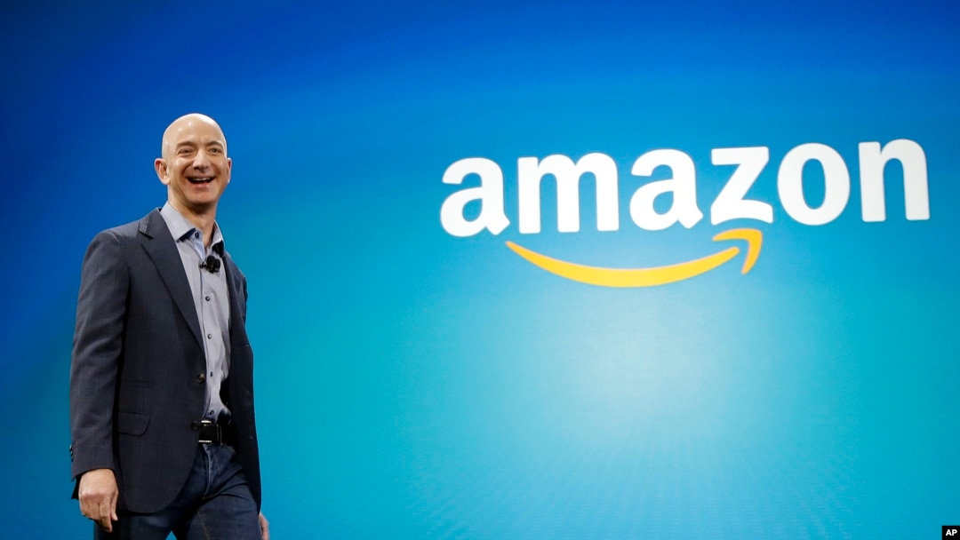 FILE - Amazon CEO Jeff Bezos walks onstage for the launch of the new Amazon Fire Phone, in Seattle. 