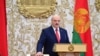 Belarusian President Alexander Lukashenko takes his oath of office during his inauguration ceremony at the Palace of the Independence in Minsk, Belarus, Sept. 23, 2020.