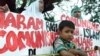 FILE - Anti-communist protesters outside the presidential palace in Jakarta in 2001. 