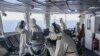 FILE - In this photo provided by the British ministry of defense, members of the HMS Diamond's Bridge team shoot down a missile fired by Houthi rebels from Yemen, April 24, 2024. 