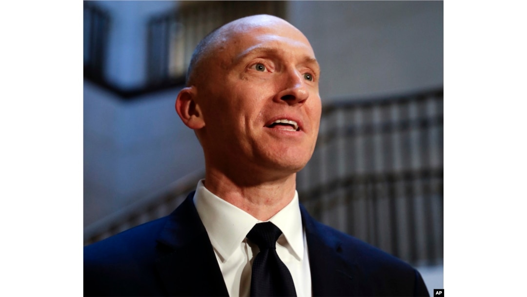 In this Nov. 2, 2017, photo, Carter Page, a foreign policy adviser to Donald Trump, speaks with reporters following a day of questions from the House Intelligence Committee, on Capitol Hill in Washington.