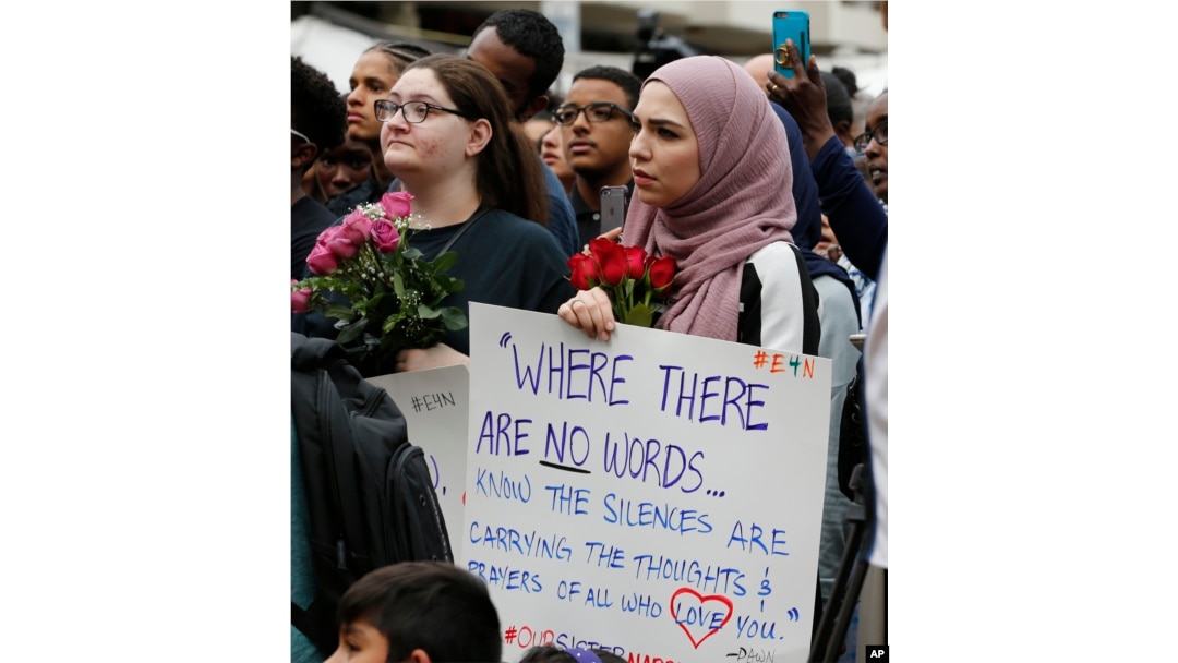 Mourners listen to speakers June 21, 2017, in Reston, Va., during a vigil in honor of Nabra Hassanen. Islamic leaders say the beating death of Nabar looks all too much like a hate crime.