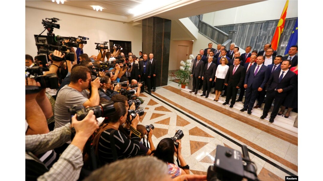 Social Democrat leader Zoran Zaev poses for a photo with newly elected ministers at Macedonian parliament in Skopje, Macedonia June 1, 2017.