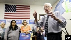 Sen. Bernie Sanders speaks to supporters during an open house at his Iowa campaign headquarters in Des Moines, Iowa.
