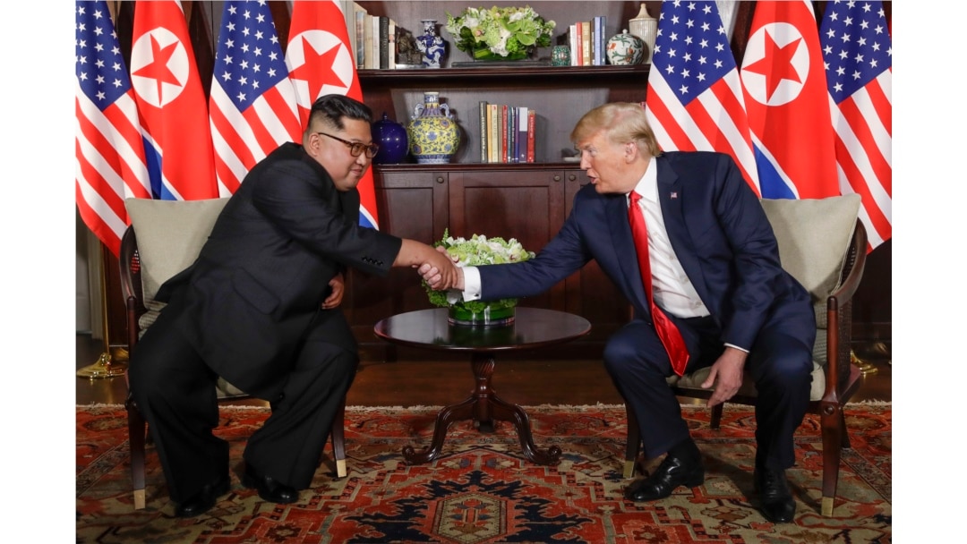 North Korea leader Kim Jong Un and U.S. President Donald Trump during their first meeting at the Capella resort on Sentosa Island Tuesday, June 12, 2018 in Singapore. (AP Photo/Evan Vucci)