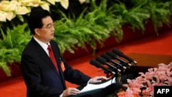 Chinese President Hu Jintao delivers his address at the opening of the 18th Communist Party Congress at the Great Hall of the People in Beijing, November 8, 2012.