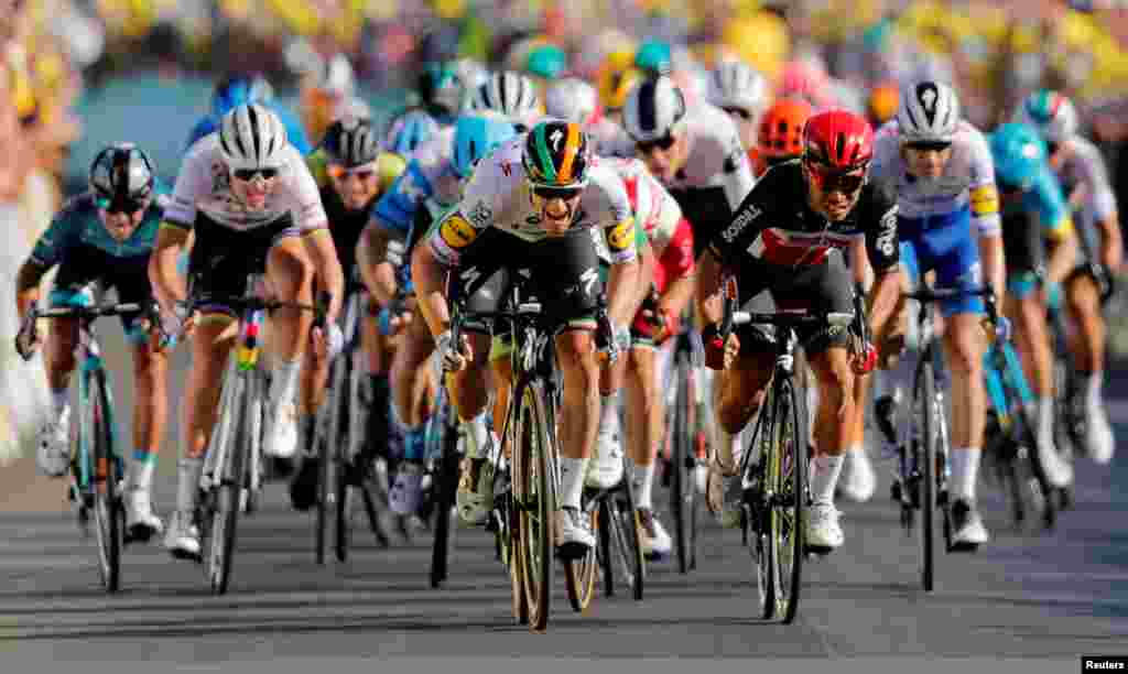 Deceuninck-Quick Step rider Sam Bennett of Ireland and Lotto Soudal rider Caleb Ewan of Australia sprint toward the line during the stage ten of the Tour de France cycling race from Ile d'Oleron to Ile de Re in France.