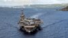 FILE - In this June 4, 2020, photo provided by the U.S. Navy, the aircraft carrier USS Theodore Roosevelt departs Apra Harbor in Guam. The carrier's strike group is now in the Middle East region, ready to defend Israel if need be.