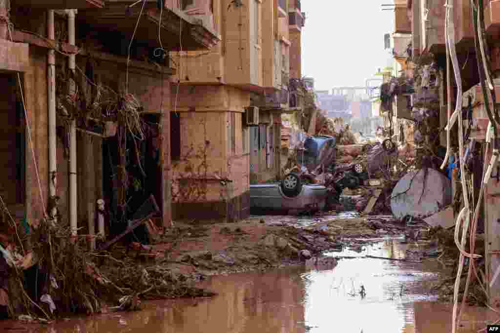 Overturned cars lay among other debris caused by flash floods in Derna, Libya, Sept. 11, 2023. Flash floods in eastern Libya killed more than 2,300 people in the Mediterranean coastal city of Derna alone, the emergency services of the Tripoli-based government said.